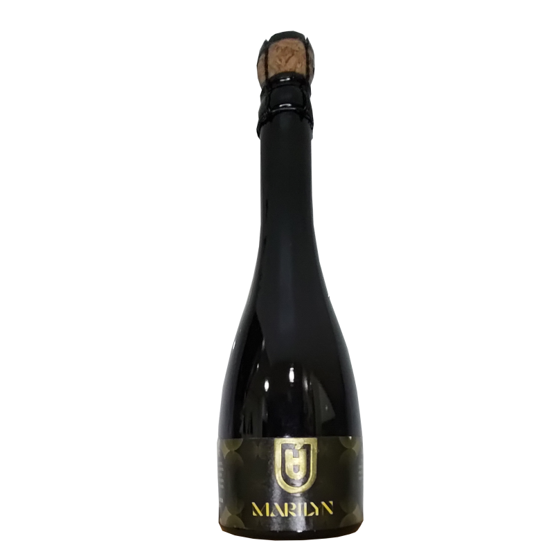 Botella de 75cl de cerveza artesana Marilyn de Dua Sparkling Beer, presentada en botella de estilo espumoso con corcho y bozal, con una etiqueta negra minimalista y elegante que destaca el logotipo dorado de Dua.